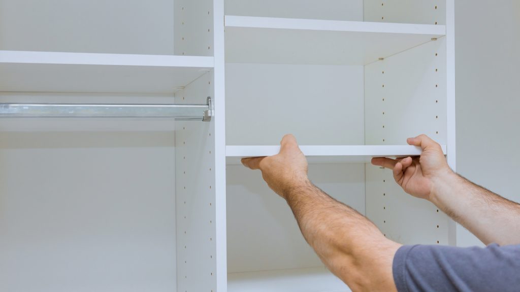 Cupboard Installation man holding frame